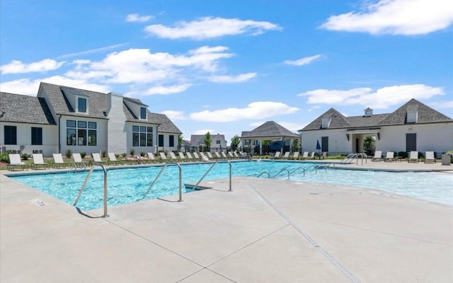 view of swimming pool with a patio