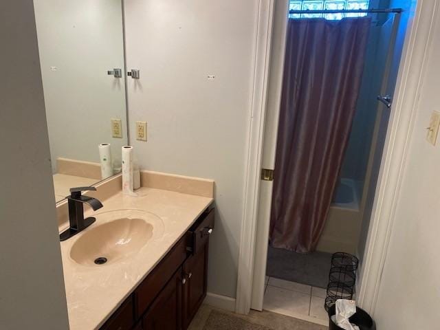 bathroom featuring tile patterned flooring and vanity