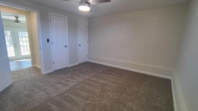 unfurnished bedroom featuring ceiling fan, carpet floors, and french doors