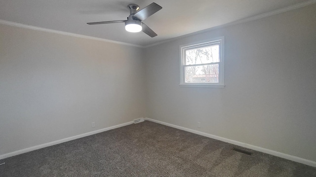 unfurnished room featuring dark carpet, ceiling fan, and crown molding