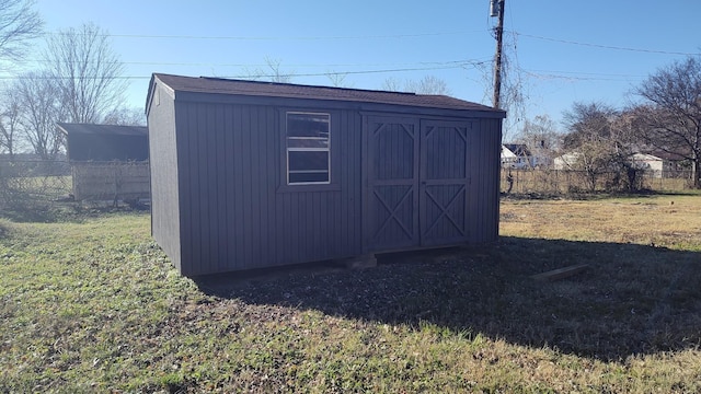 view of outdoor structure featuring a yard