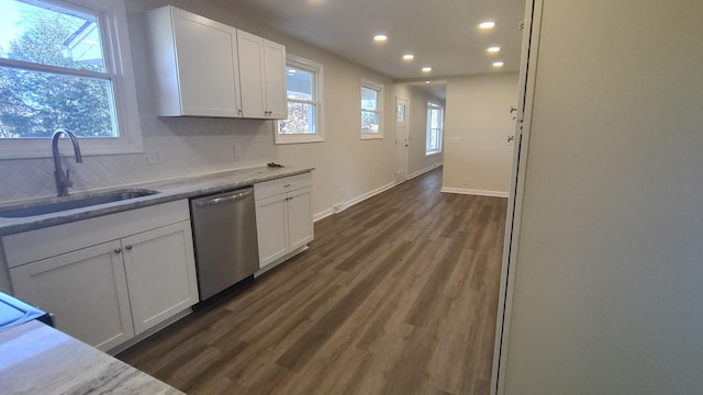 kitchen with white cabinets, dishwasher, dark hardwood / wood-style flooring, and sink