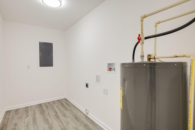 laundry room featuring hookup for an electric dryer, water heater, light hardwood / wood-style flooring, electric panel, and hookup for a washing machine