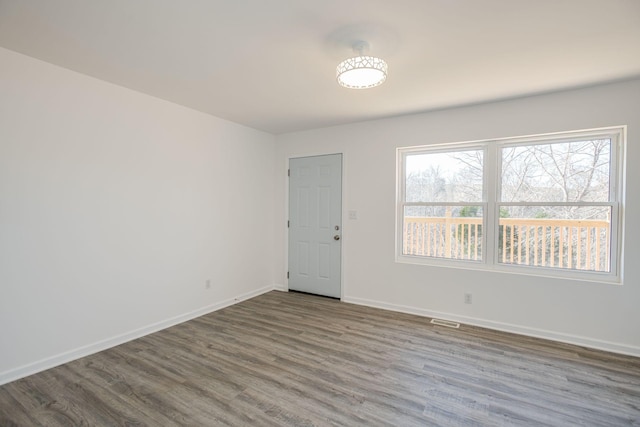 empty room featuring hardwood / wood-style flooring