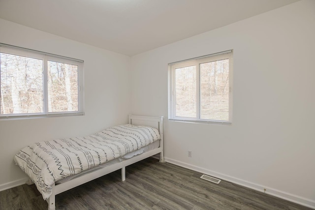 bedroom featuring dark hardwood / wood-style flooring