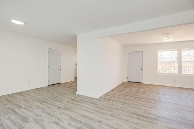 unfurnished room with light hardwood / wood-style floors