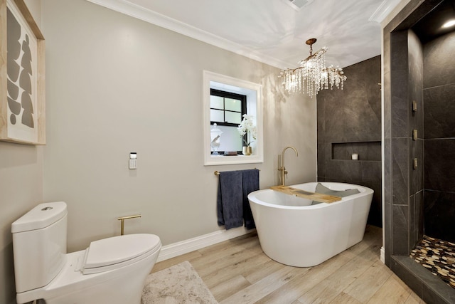 bathroom with wood-type flooring, toilet, ornamental molding, and a tub