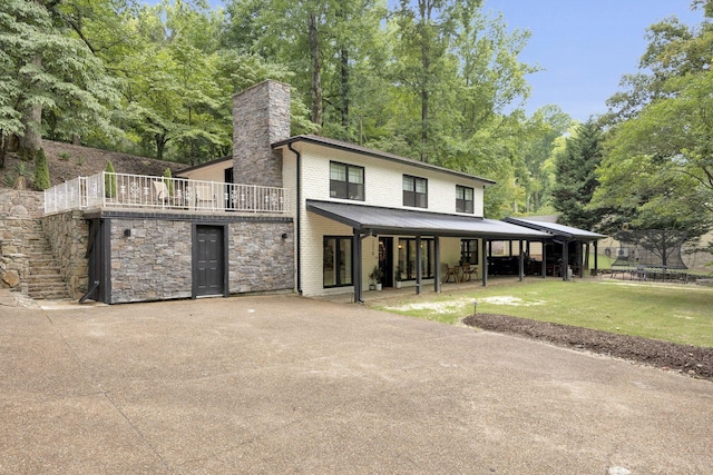 view of front of property with a front yard and a trampoline