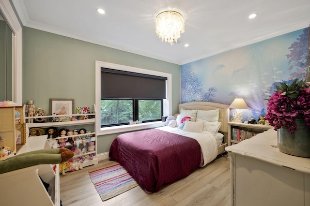 bedroom with crown molding, light hardwood / wood-style floors, and an inviting chandelier