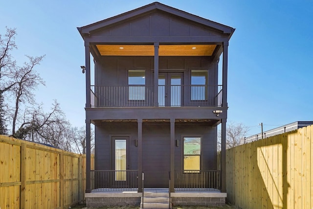 back of house with a balcony