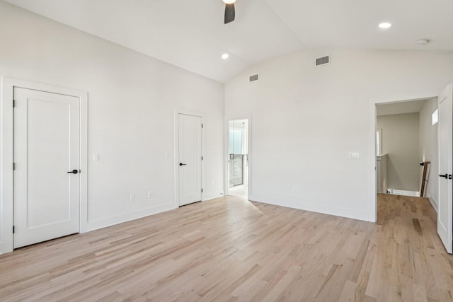 unfurnished bedroom with high vaulted ceiling, light hardwood / wood-style flooring, and ceiling fan