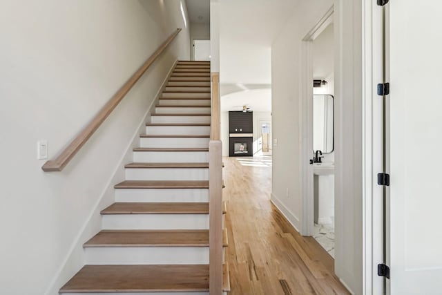 stairs featuring wood-type flooring