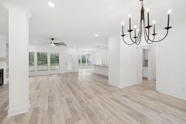 unfurnished living room featuring light wood-type flooring and ceiling fan