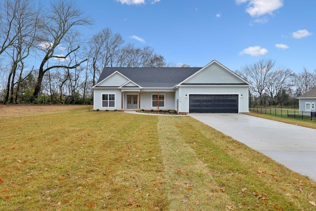 view of front of property featuring a garage and a front lawn