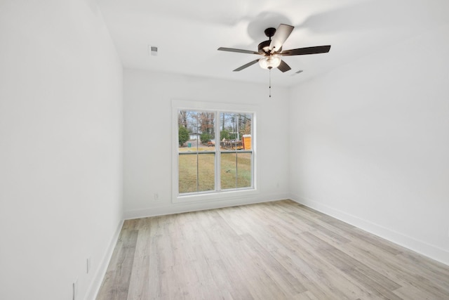 empty room featuring ceiling fan and light wood-type flooring