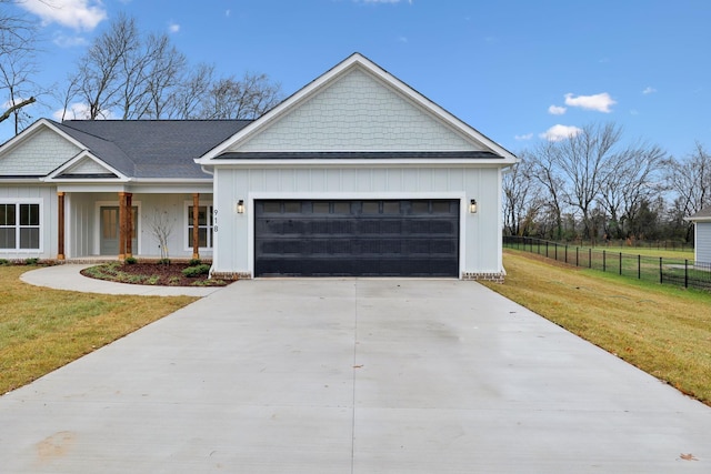 view of front of home featuring a front lawn and a garage