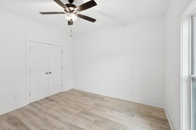 unfurnished bedroom with a closet, ceiling fan, and light hardwood / wood-style flooring