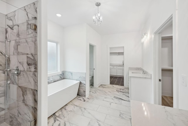 full bathroom with vanity, toilet, shower with separate bathtub, and a chandelier