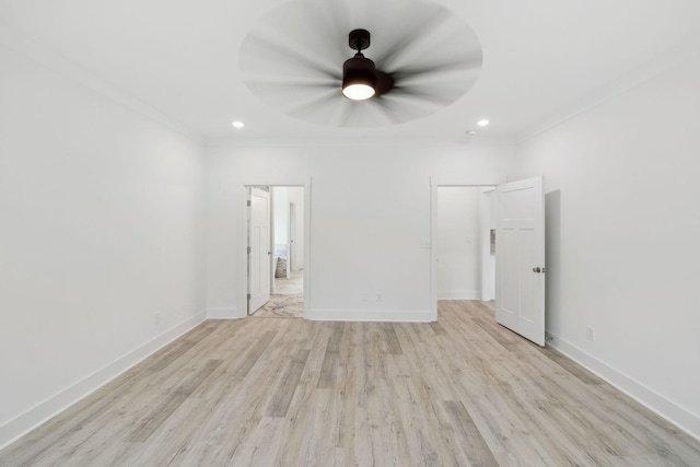 unfurnished bedroom featuring ceiling fan, crown molding, and light hardwood / wood-style flooring