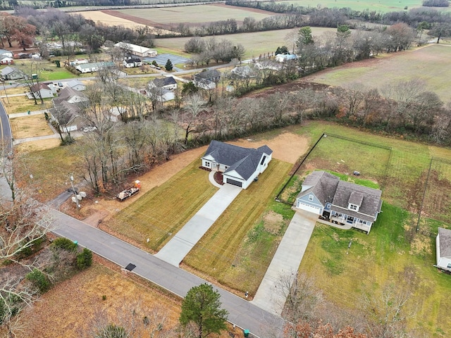 birds eye view of property with a rural view