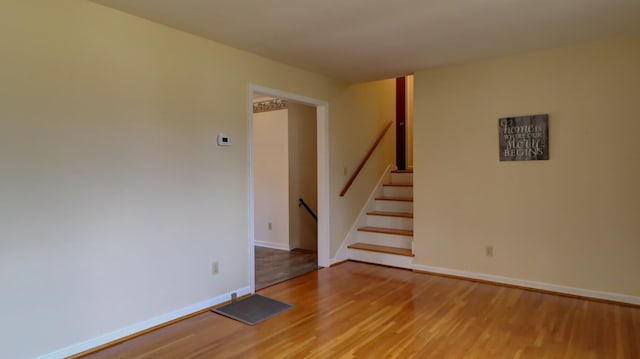 empty room with light hardwood / wood-style floors