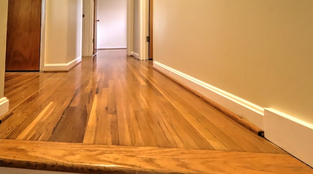 corridor featuring hardwood / wood-style floors