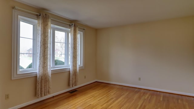 unfurnished room featuring light wood-type flooring