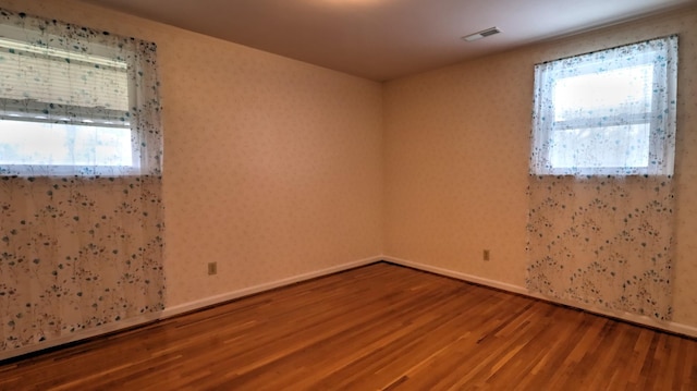 unfurnished room featuring wood-type flooring