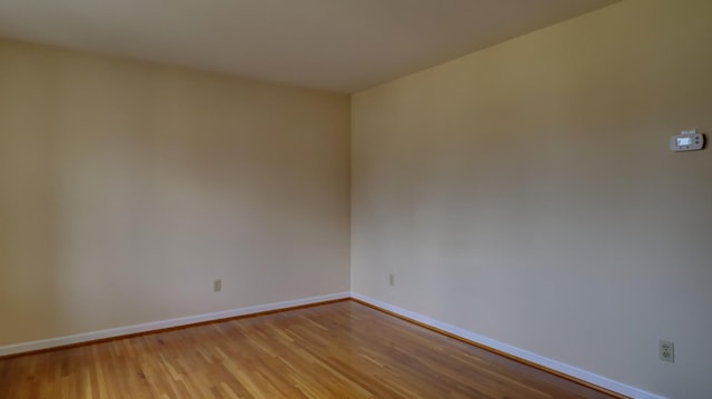 unfurnished room with light hardwood / wood-style floors