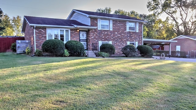 view of front facade with a front yard and a carport