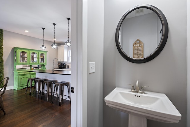 bathroom featuring hardwood / wood-style flooring and sink