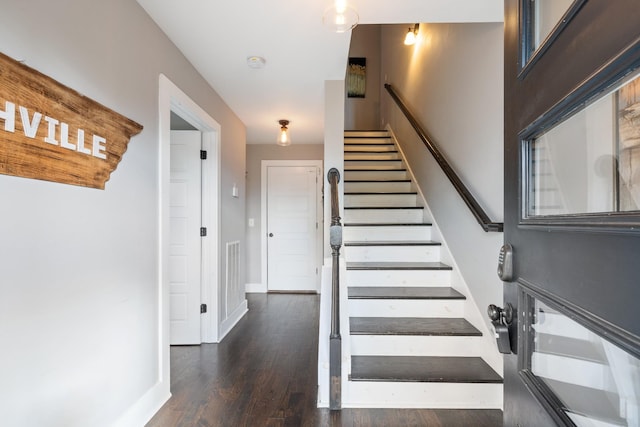 stairs with wood-type flooring