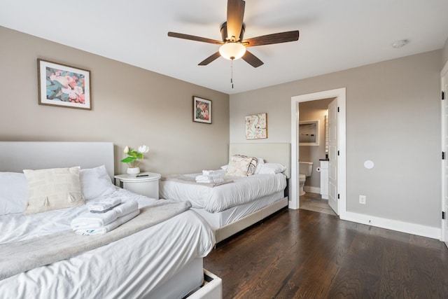 bedroom featuring ceiling fan, dark hardwood / wood-style flooring, and ensuite bath