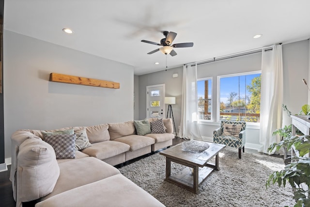 living room with ceiling fan and hardwood / wood-style floors