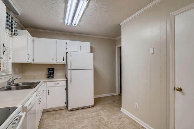 kitchen with white appliances, white cabinets, sink, ornamental molding, and a textured ceiling