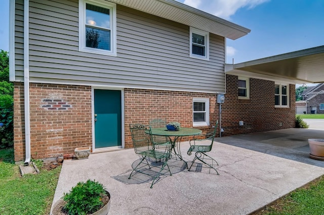 back of property featuring a patio area