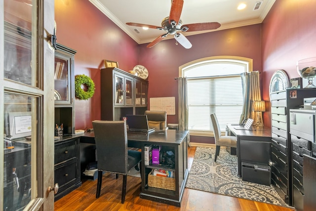 office space featuring ceiling fan, dark wood-type flooring, and ornamental molding