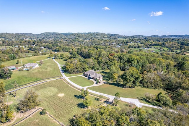 birds eye view of property with a rural view