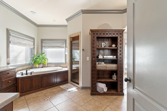 bathroom featuring tile patterned floors, crown molding, and a tub