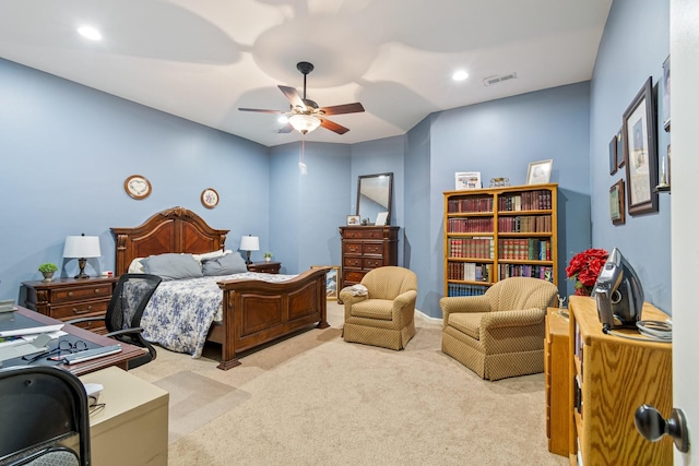 bedroom with ceiling fan and light colored carpet