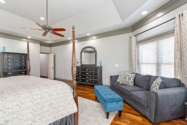 bedroom with wood-type flooring, ceiling fan, and crown molding