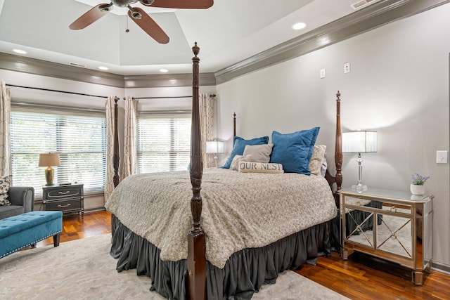 bedroom with crown molding, hardwood / wood-style floors, and ceiling fan