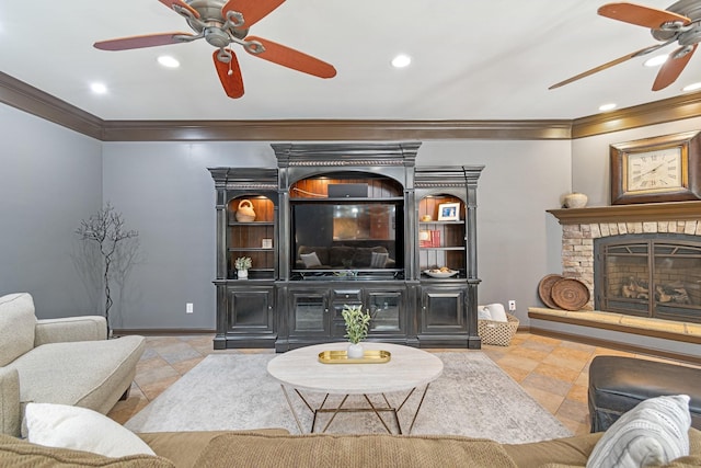 living room featuring crown molding, a fireplace, light tile patterned flooring, and ceiling fan