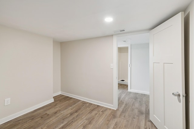 spare room with light wood-type flooring