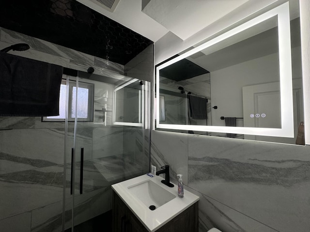 bathroom with vanity and an enclosed shower