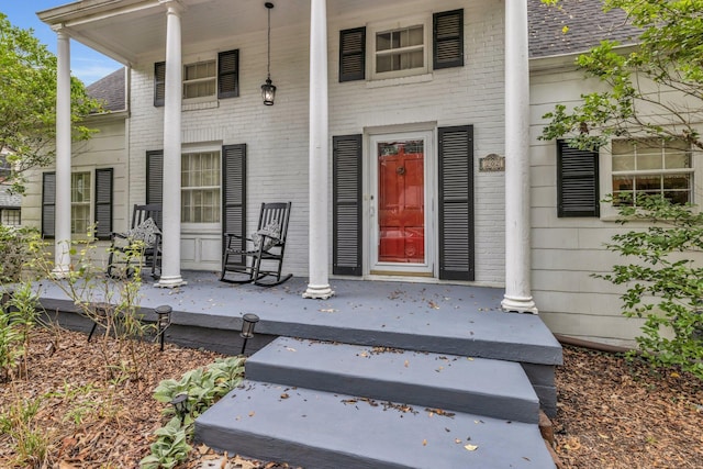 property entrance featuring covered porch