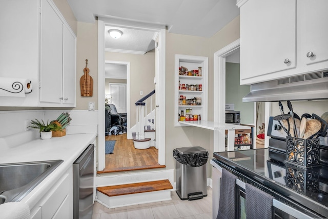 kitchen with ventilation hood, light tile patterned flooring, white cabinets, and appliances with stainless steel finishes