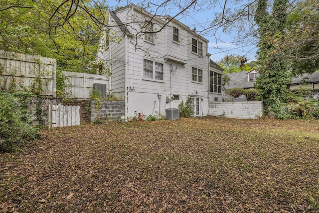 rear view of house with central AC