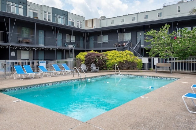 view of swimming pool featuring a patio area