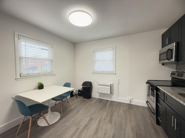 office space with hardwood / wood-style flooring and a wall mounted AC